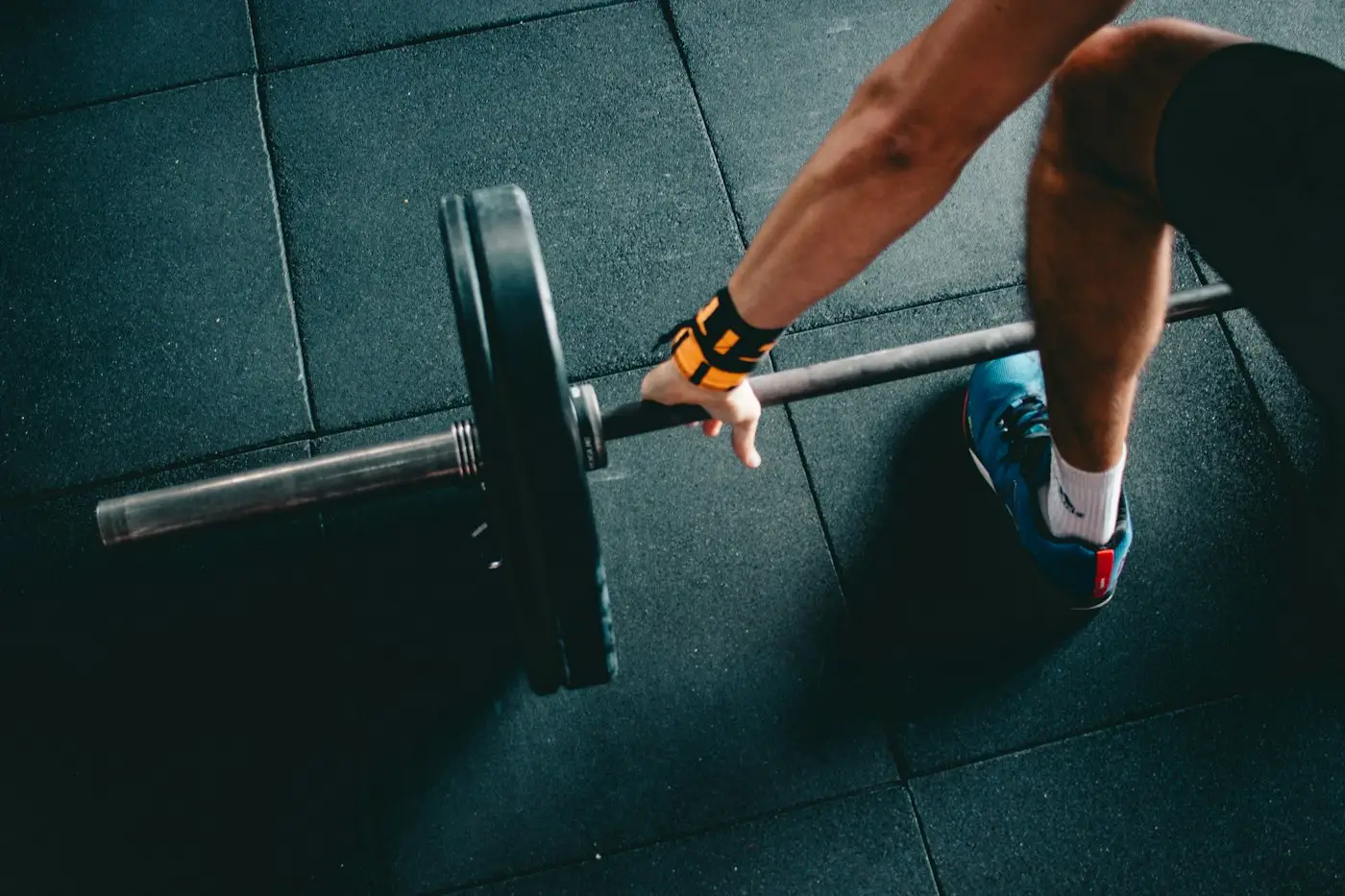 Lifter gripping a barbell