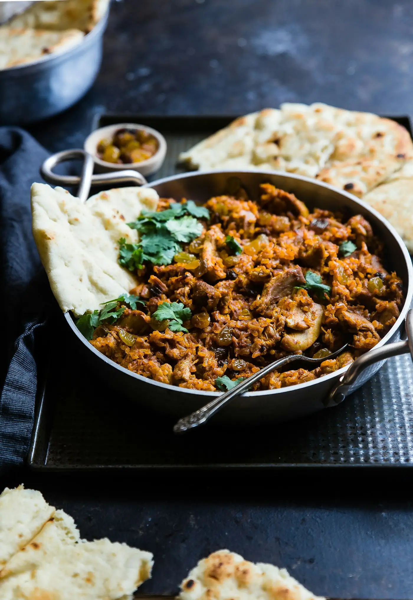 Indian curry in a pan with naan