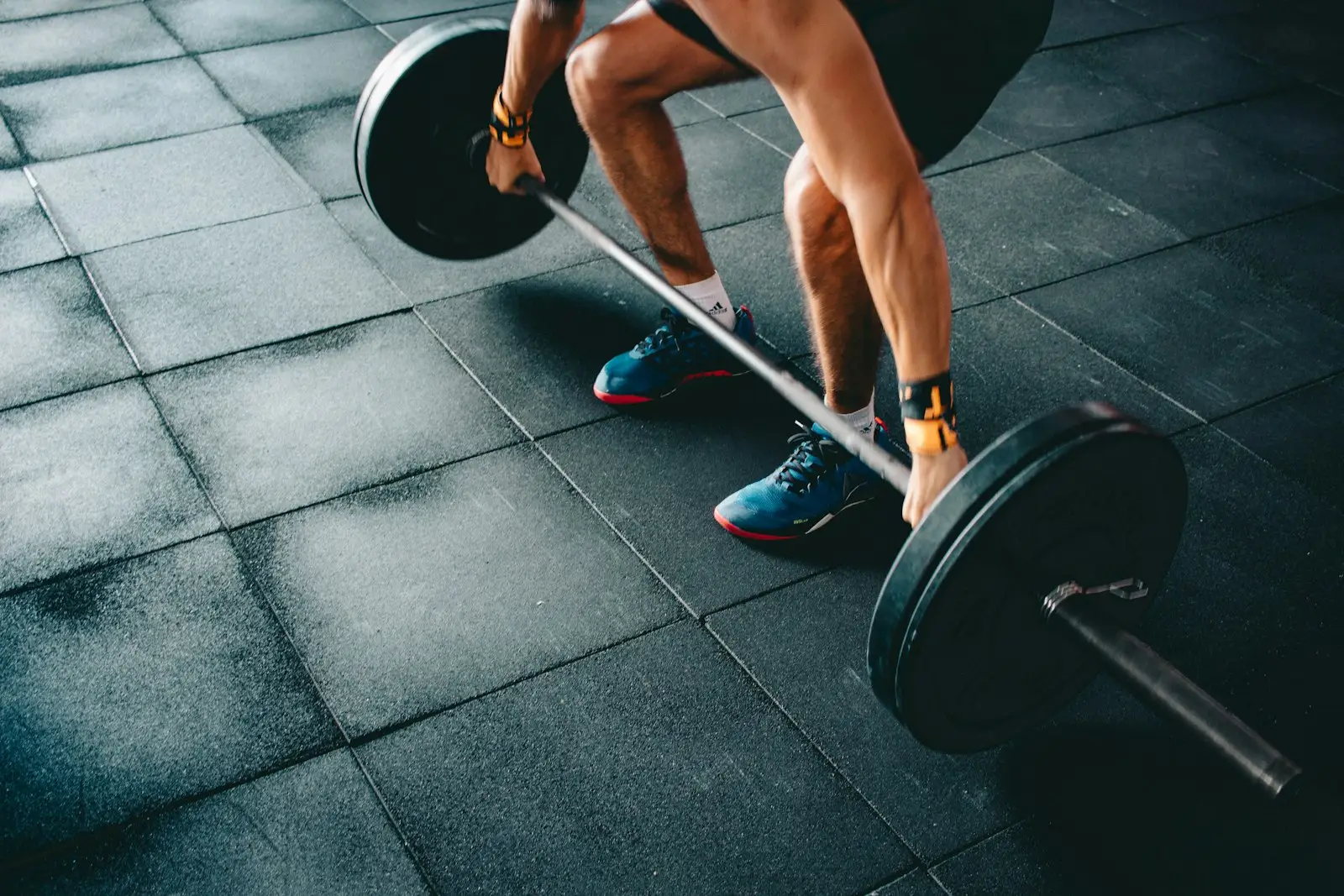 Hand gripping a barbell